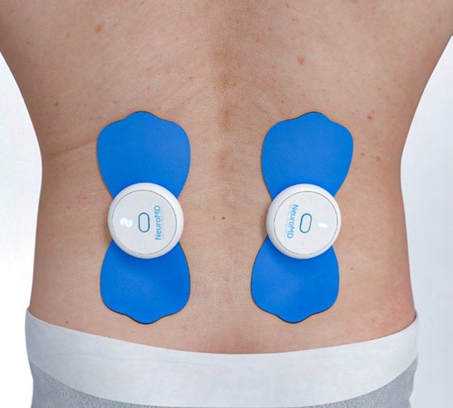 Electrode pads placed either side of the lower spine